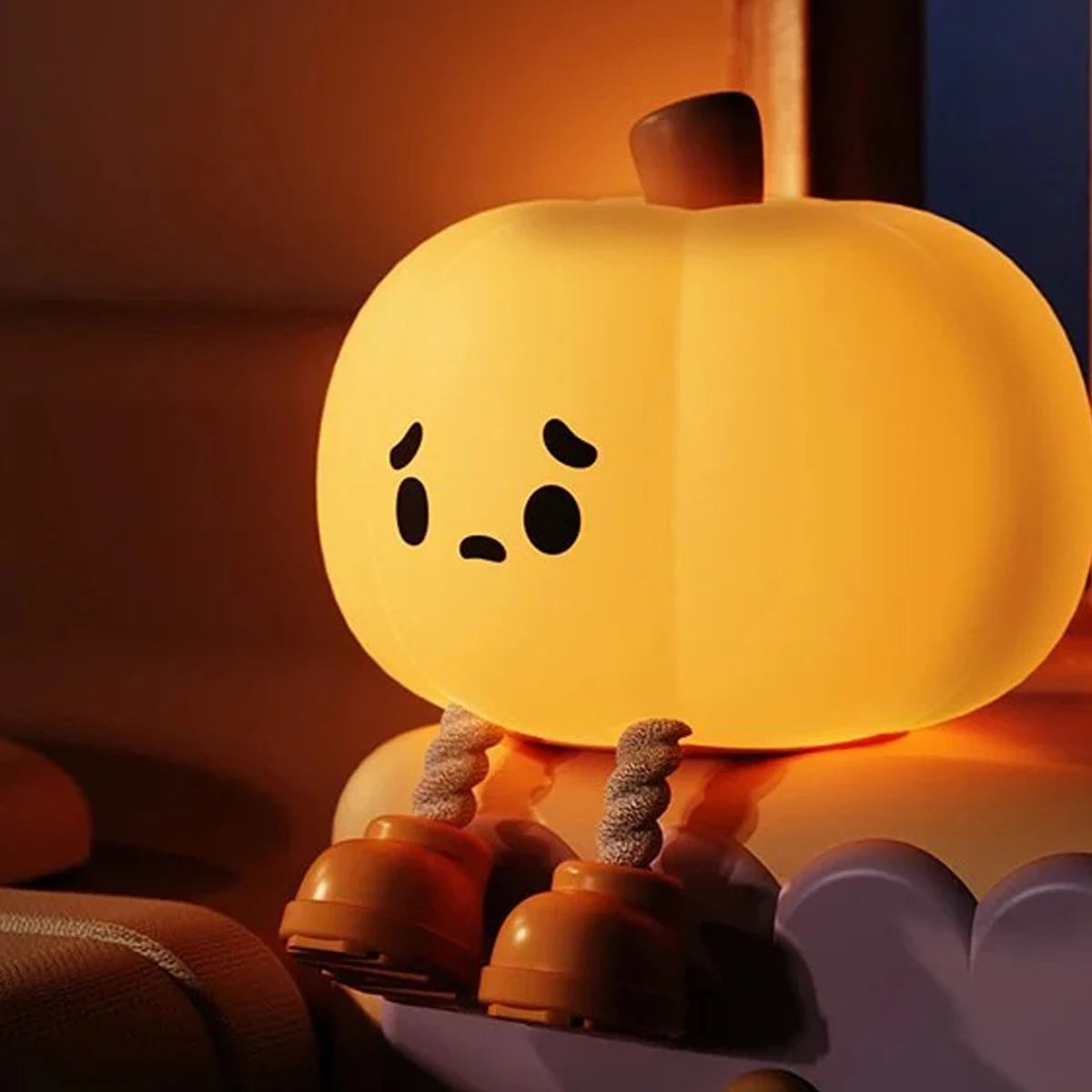 All Season Soul cute pumpkin-shaped LED night light with a warm yellow glow, expressive face, and playful design for cozy seasonal home décor.